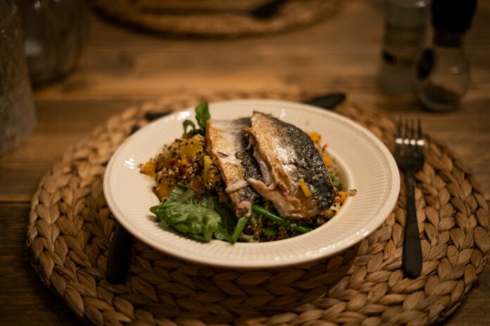 Photo by Paul Einerhand cooked fish on white ceramic plate